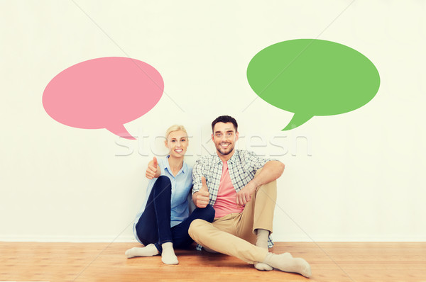 happy couple showing thumbs up at new home Stock photo © dolgachov