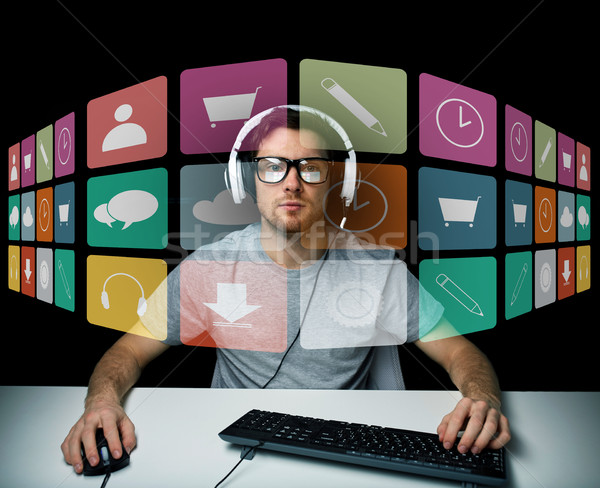 Homme casque icônes informatiques écran technologie médias [[stock_photo]] © dolgachov