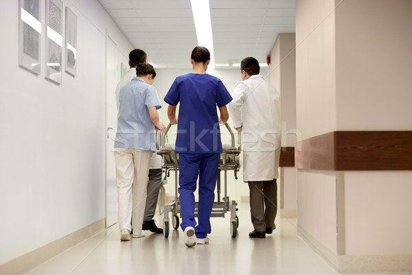 medics carrying hospital gurney to emergency room Stock photo © dolgachov