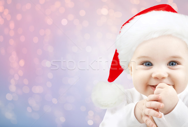 happy baby in santa hat over holidays lights Stock photo © dolgachov