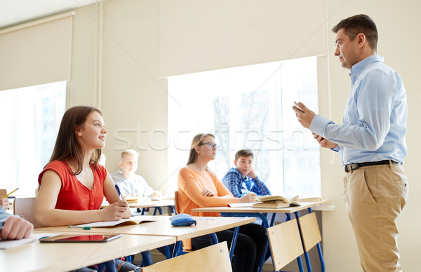 students and teacher with tablet pc at school Stock photo © dolgachov
