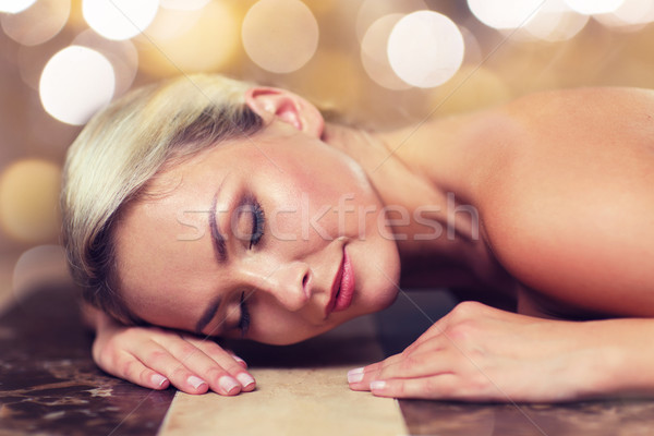 young woman lying on hammam table in turkish bath Stock photo © dolgachov