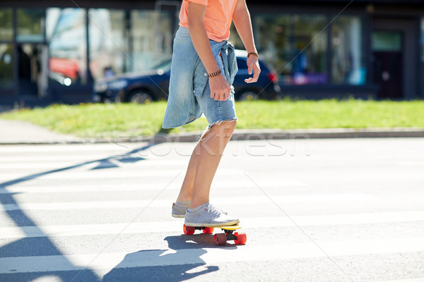 teenage boy on skateboard crossing city crosswalk Stock photo © dolgachov