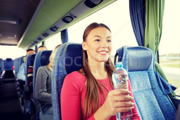 Szczęśliwy młoda kobieta manierka podróży autobus transportu Zdjęcia stock © dolgachov
