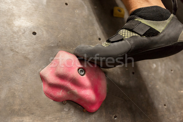 foot of man exercising at indoor climbing gym Stock photo © dolgachov