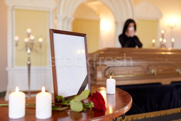 photo frame and woman crying at coffin at funeral Stock photo © dolgachov