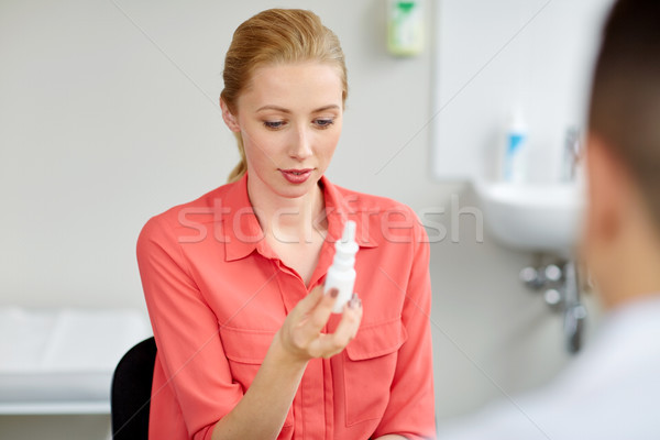 woman with nasal spray and doctor at hospital Stock photo © dolgachov