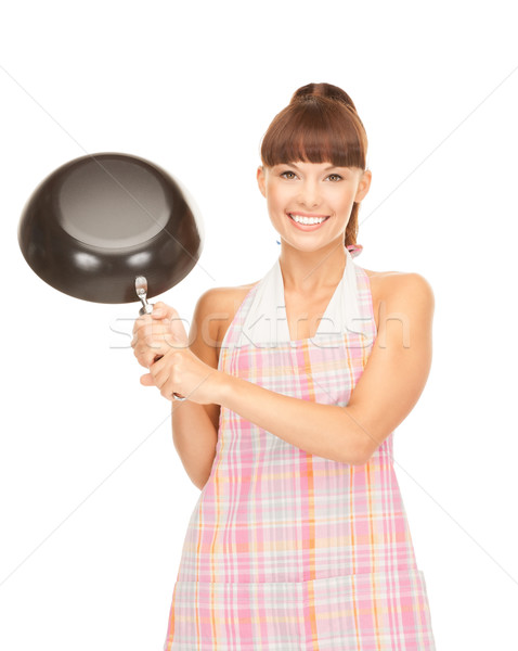 housewife with frying pan Stock photo © dolgachov