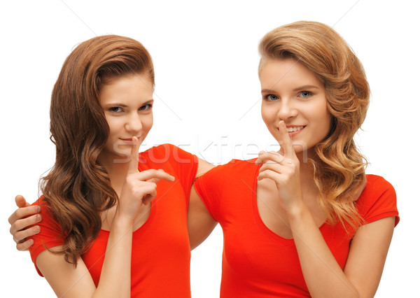 two teenage girls showing hush gesture Stock photo © dolgachov