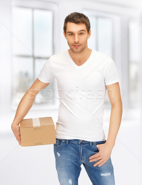 man in white shirt with parsel Stock photo © dolgachov
