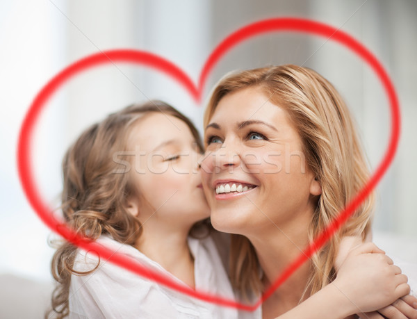 smiling mother and daughter hugging Stock photo © dolgachov