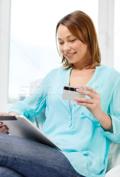 happy woman with tablet pc and credit card at home Stock photo © dolgachov