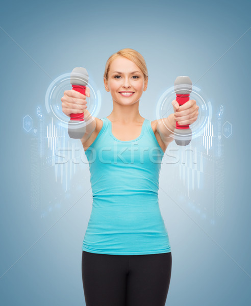 young sporty woman with light dumbbells Stock photo © dolgachov