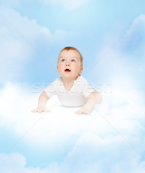 crawling curious baby looking up Stock photo © dolgachov