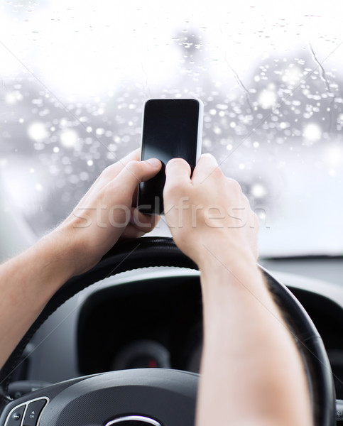 Közelkép férfi okostelefon vezetés autó közlekedés Stock fotó © dolgachov