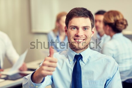 Stock photo: group of smiling businesspeople meeting in office