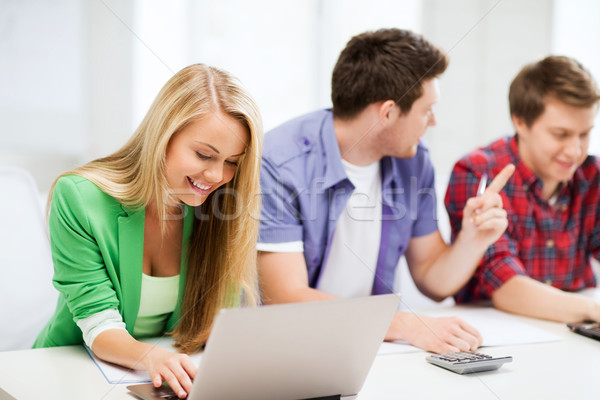 students writing test or exam in lecture at school Stock photo © dolgachov