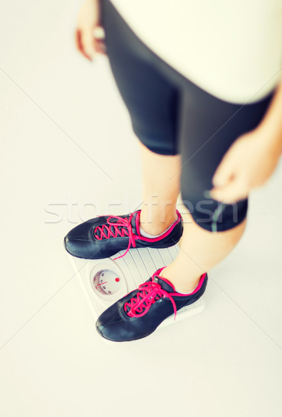 woman legs standing on scales Stock photo © dolgachov