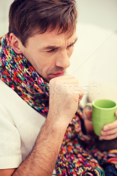 ill man with flu at home Stock photo © dolgachov