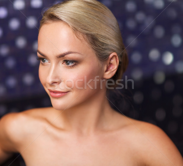 close up of young woman sitting in bath towel Stock photo © dolgachov