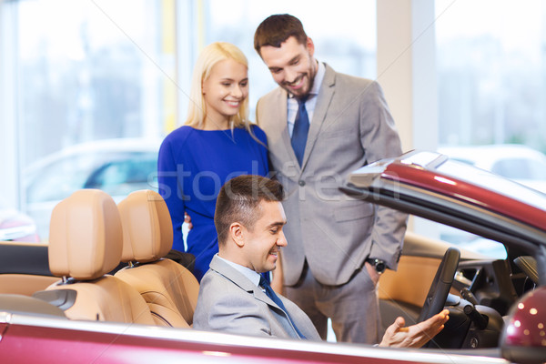 Heureux couple Auto montrent salon [[stock_photo]] © dolgachov