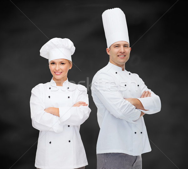 happy male chef cook with crossed hands Stock photo © dolgachov