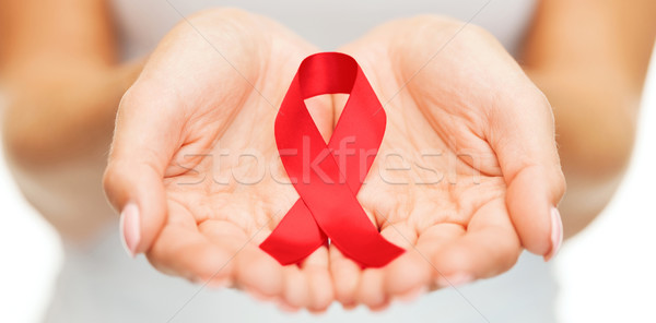 Kezek tart piros AIDS tudatosság szalag Stock fotó © dolgachov
