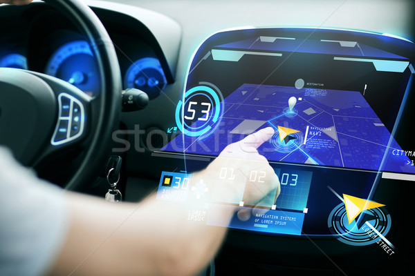 male hand using navigation system on car dashboard Stock photo © dolgachov