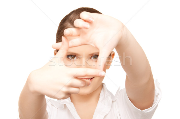 Stock photo: lovely woman creating a frame with fingers