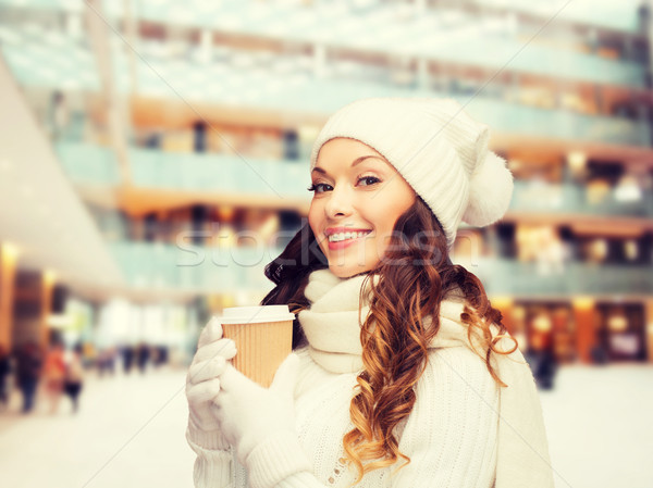 smiling young woman in winter clothes with cup Stock photo © dolgachov