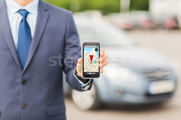 close up of business man with smartphone navigator Stock photo © dolgachov