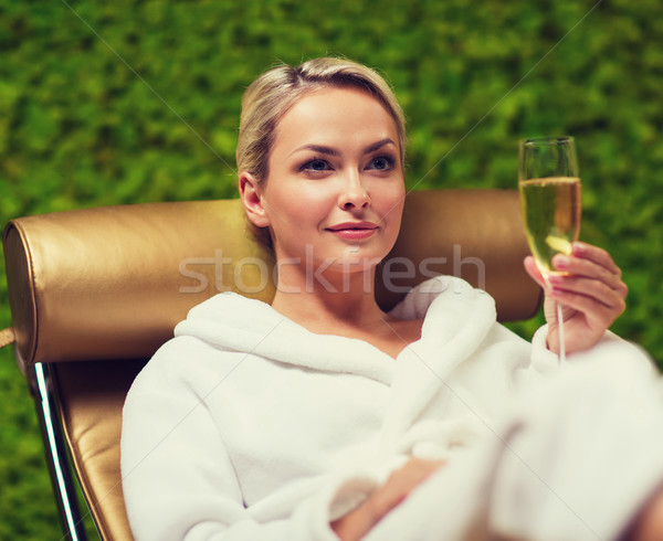 beautiful young woman drinking champagne at spa Stock photo © dolgachov