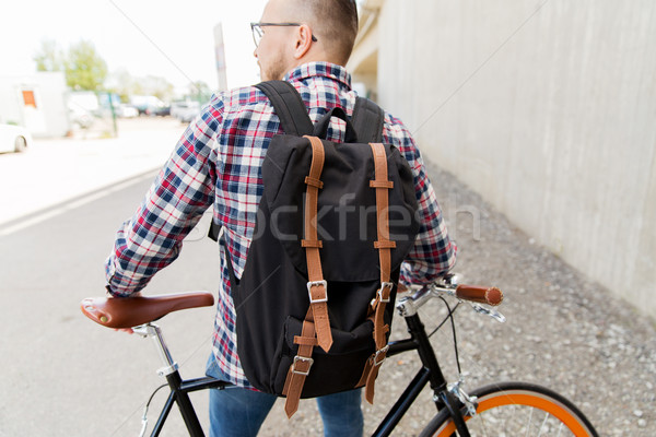 Homme fixé engins vélo sac à dos [[stock_photo]] © dolgachov