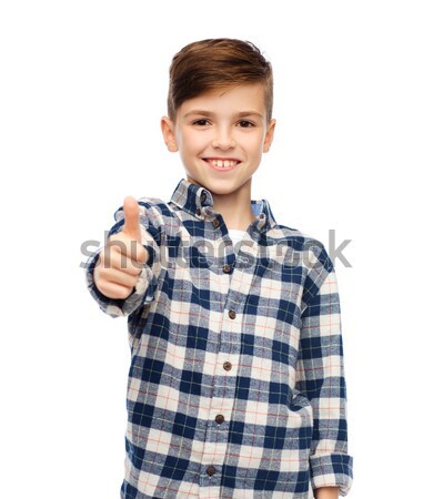 Souriant garçon à carreaux shirt Photo stock © dolgachov