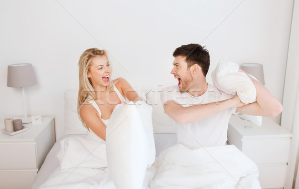 Mutlu çift yastık kavgası yatak ev insanlar Stok fotoğraf © dolgachov