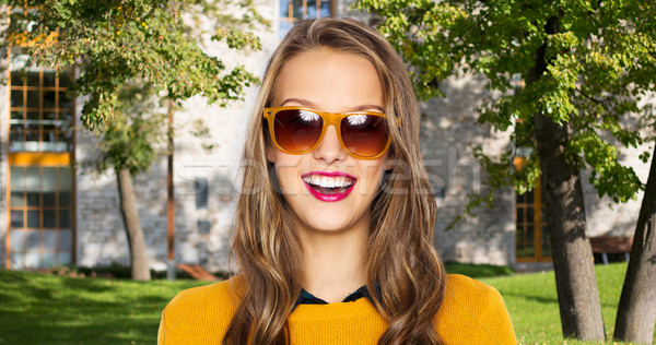 happy young woman or teen girl in casual clothes Stock photo © dolgachov