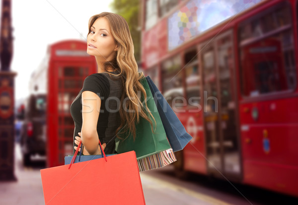 woman with shopping bags over london city street Stock photo © dolgachov