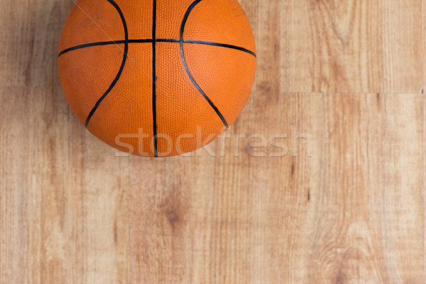 close up of basketball ball on wooden floor Stock photo © dolgachov