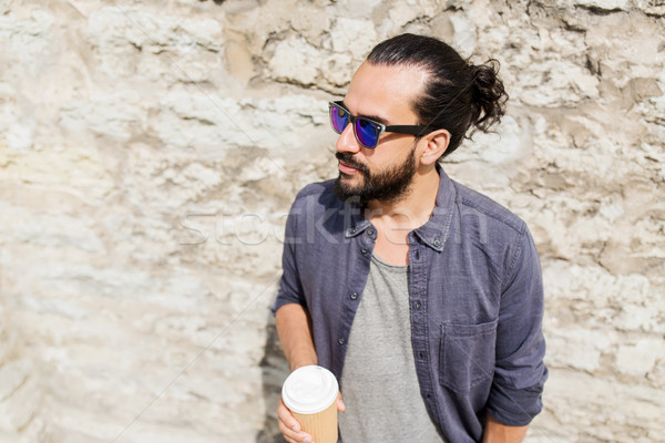 man drinking coffee from paper cup on street Stock photo © dolgachov