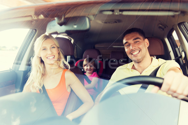 happy family with little child driving in car Stock photo © dolgachov