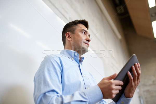 teacher or lector with tablet pc at lecture Stock photo © dolgachov