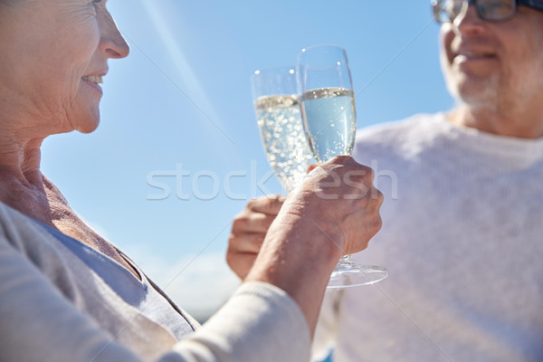 Heureux couple de personnes âgées potable champagne extérieur famille [[stock_photo]] © dolgachov