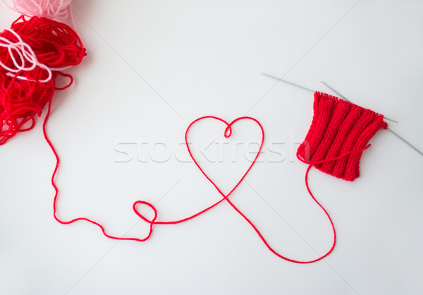 knitting needles and thread in heart shape Stock photo © dolgachov