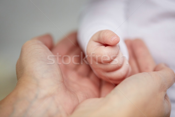 close up of mother and newborn baby hands Stock photo © dolgachov