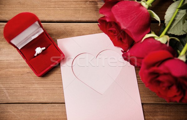 close up of diamond ring, roses and greeting card Stock photo © dolgachov
