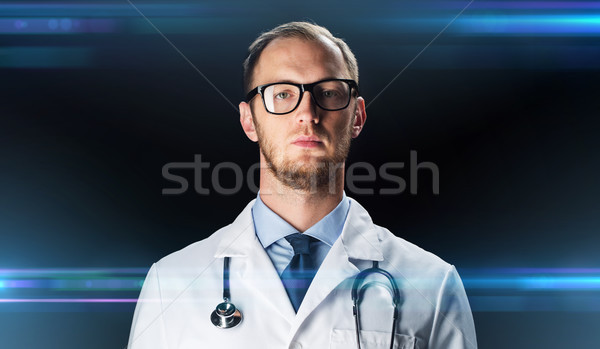 close up of doctor in white coat with stethoscope Stock photo © dolgachov
