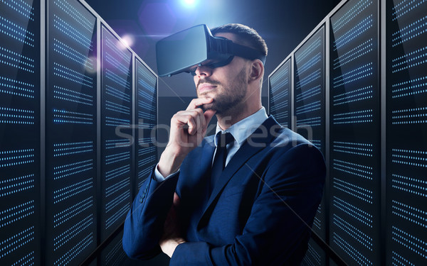 businessman in virtual reality headset Stock photo © dolgachov