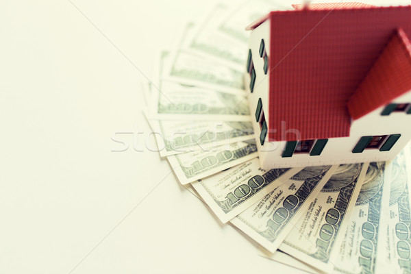 close up of home or house model and money Stock photo © dolgachov