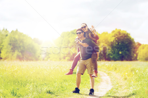 happy couple with backpacks having fun outdoors Stock photo © dolgachov