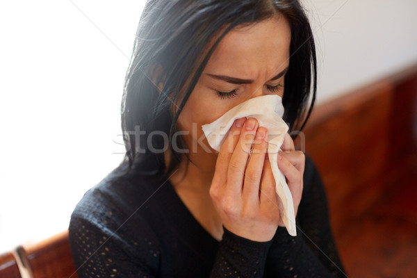 crying woman blowing nose with wipe at funeral day Stock photo © dolgachov